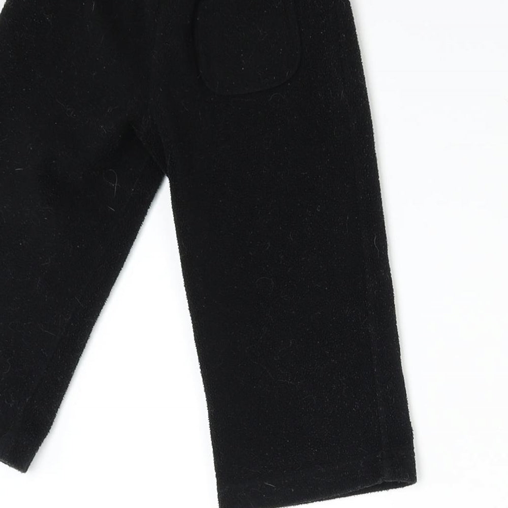 Brand and care label for Baby Gap boys’ black fleece sweatpants, size 2, years