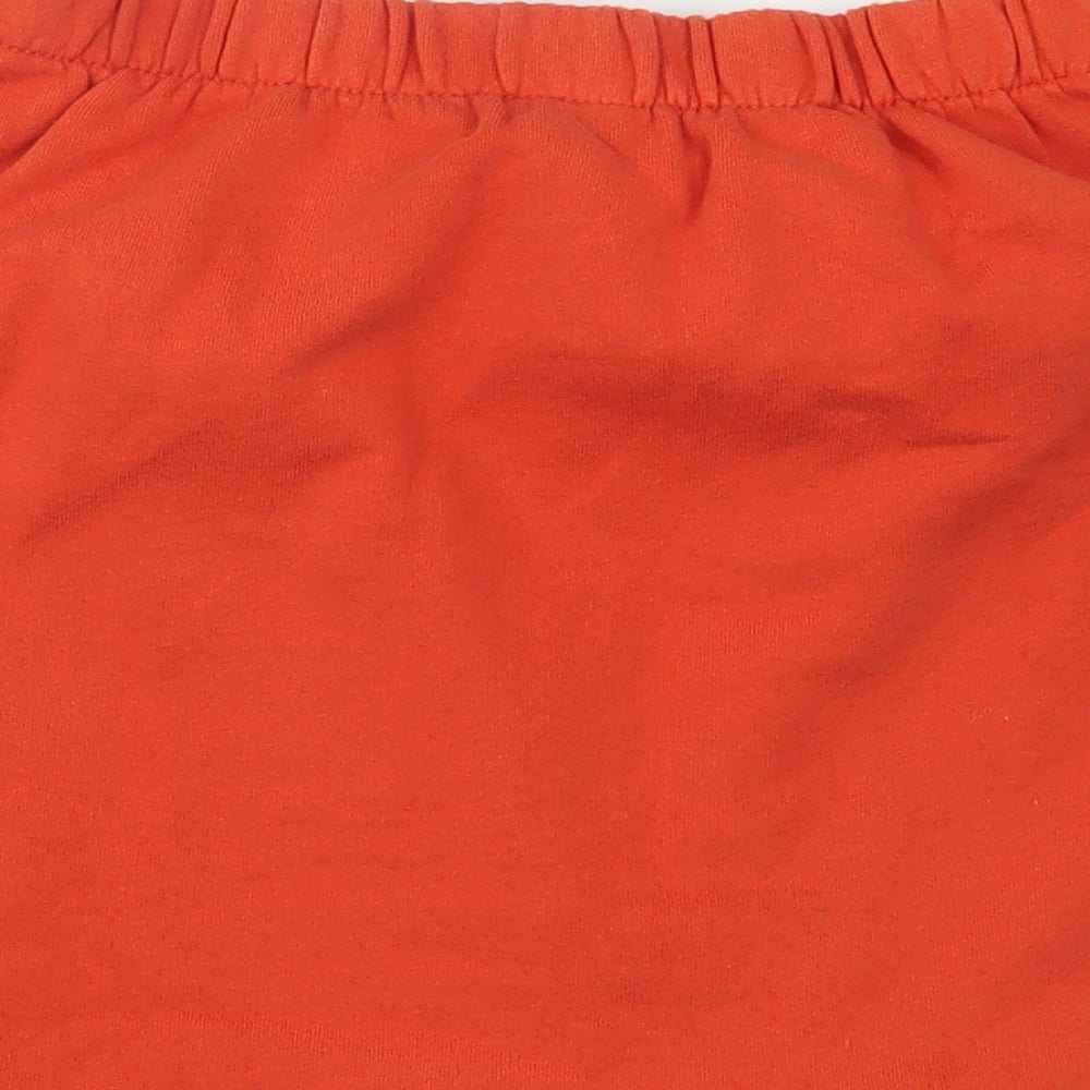 Brand and care label for Bershka women’s orange mini skirt, size M
