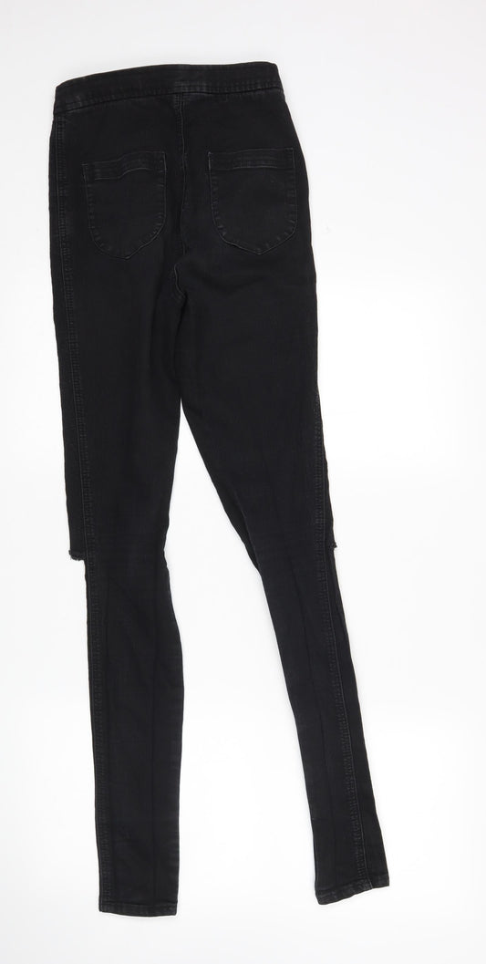 Back view of ASOS women’s black skinny jeans, size UK 26, in, 32-inch leg