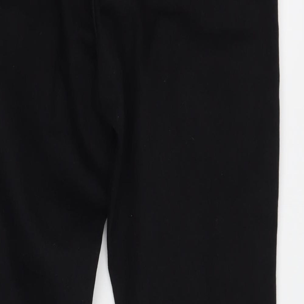 Brand and care label for Boohoo women’s black skinny jeans, size UK 12, 26-inch leg