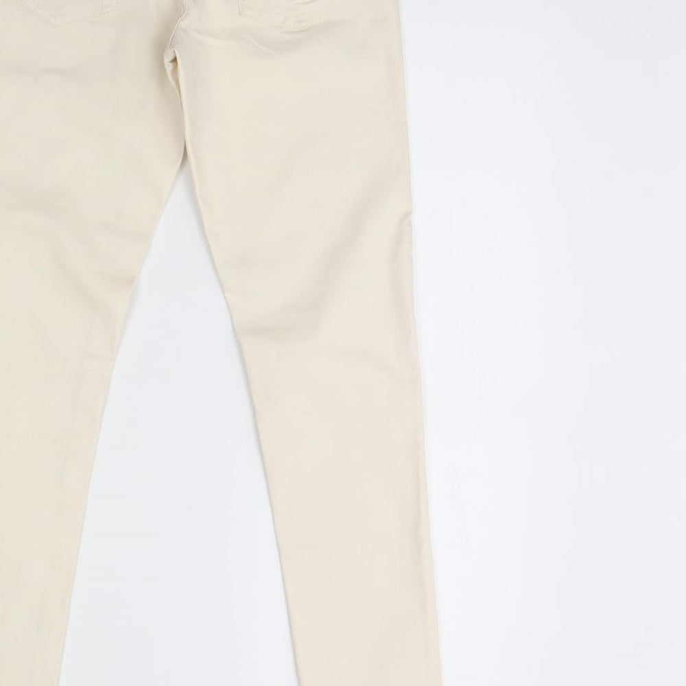 Brand and care label for Forever 21 women’s ivory denim skinny jeans, size UK 26, 29-inch leg