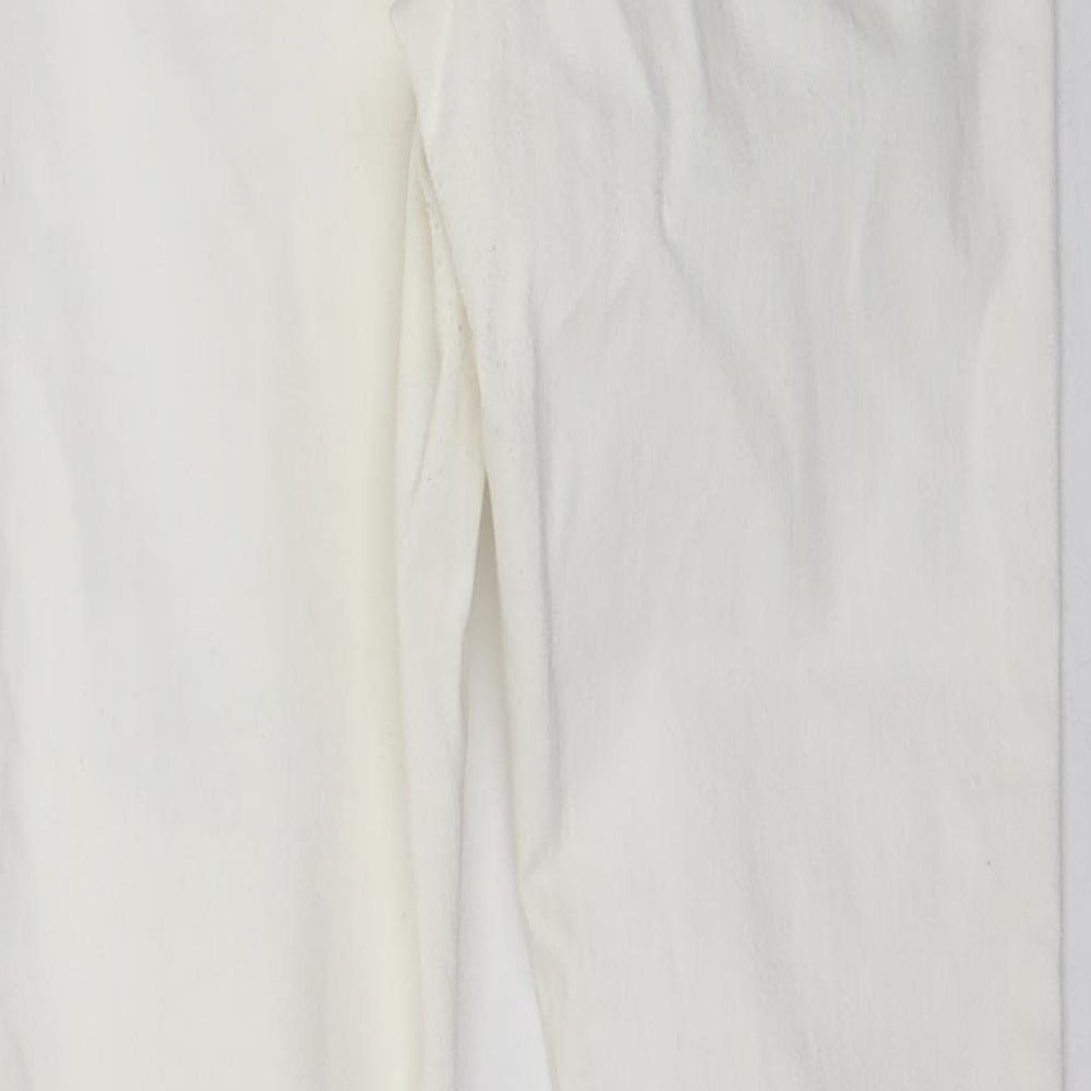 Brand and care label for Miss Selfridge women’s ivory denim skinny jeans, size UK 10, 29-inch leg