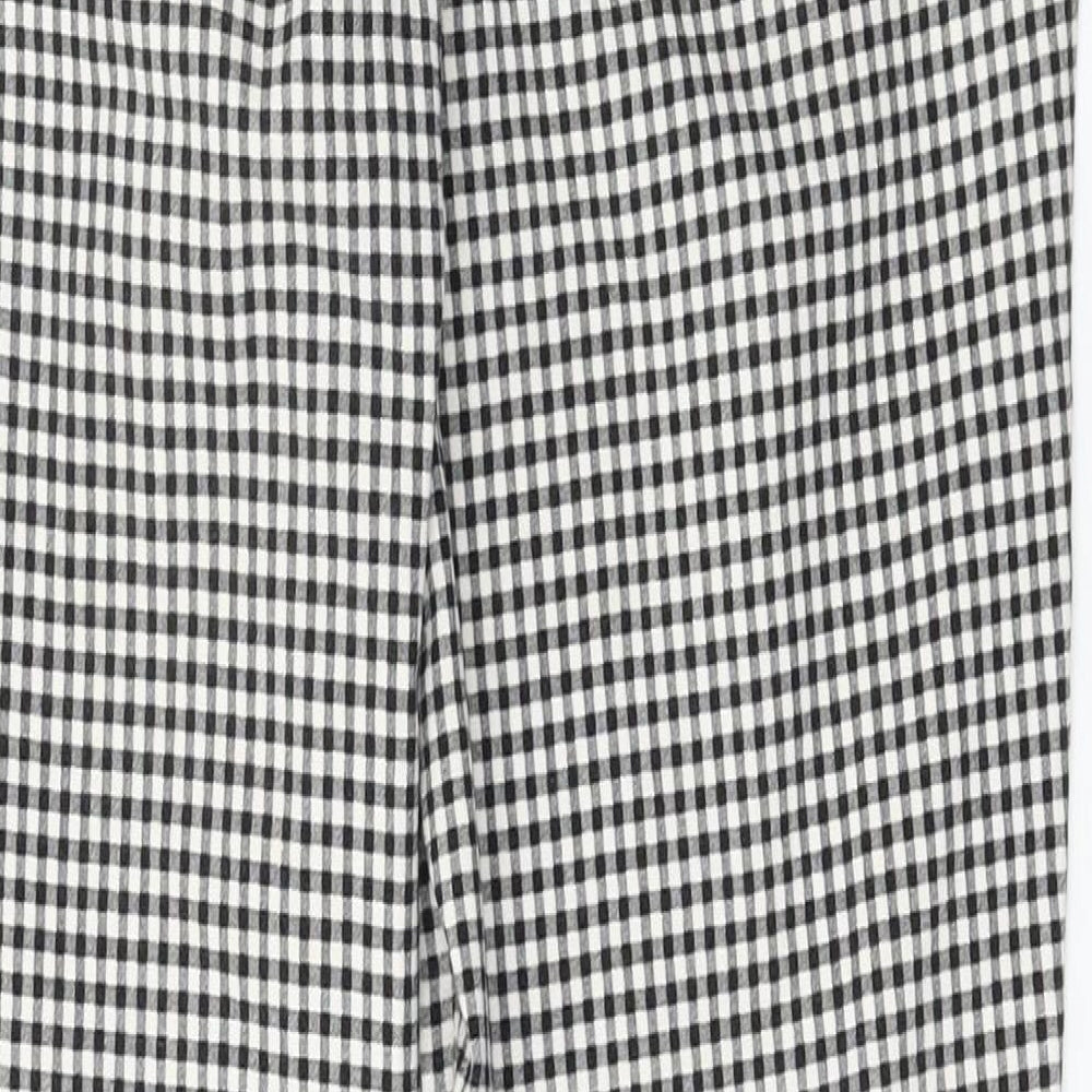 Brand and care label for F&F women’s black check trousers, size UK 10, 26-inch leg