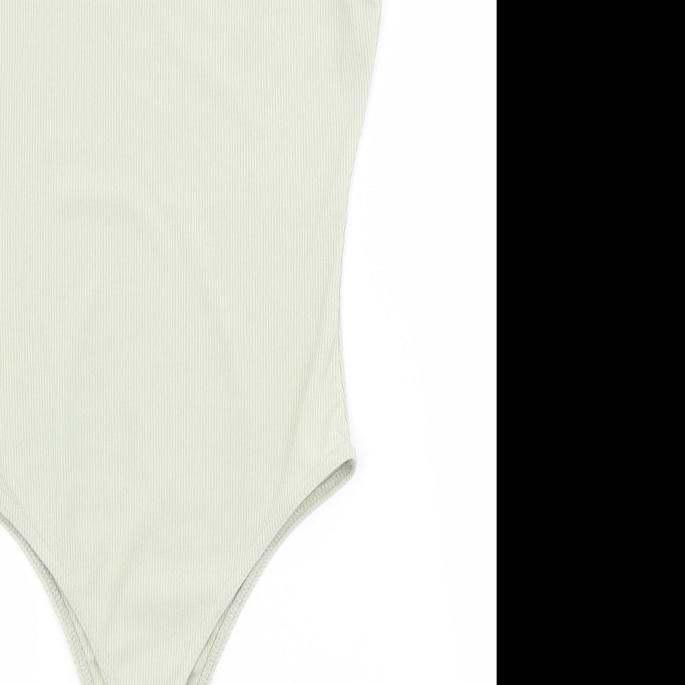 Brand and care label for Boohoo women’s green unitard one-piece, size UK 12