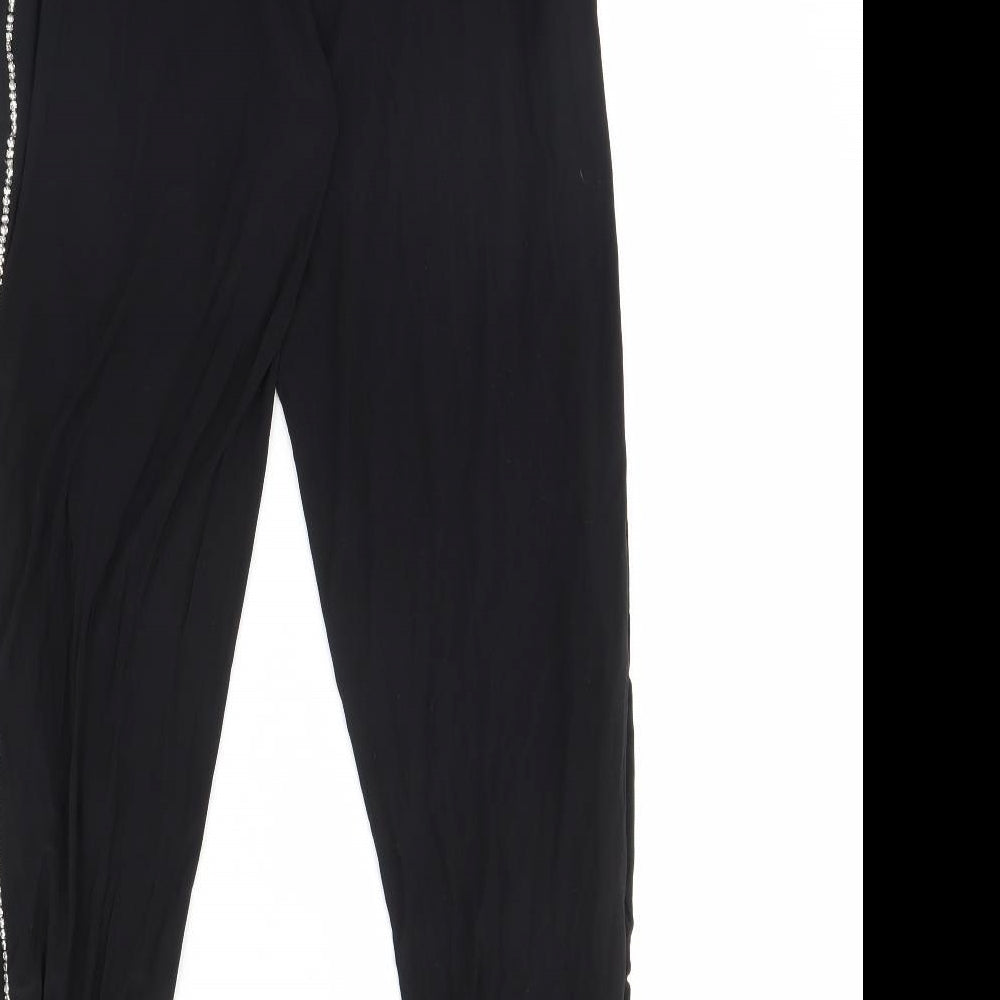 Brand and care label for PRETTYLITTLETHING women’s black trousers, size UK 8, 28-inch leg