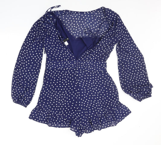 Back view of Divided women’s blue polka dot jumpsuit one-piece, size UK 10
