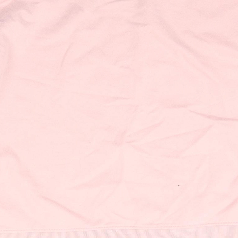 Brand and care label for Primark women’s pink jumper, size M