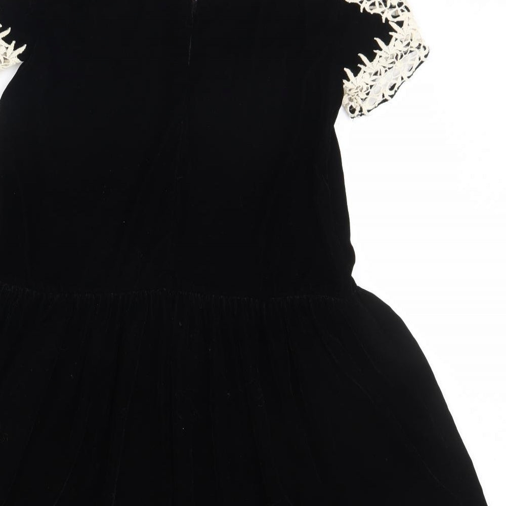 Brand and care label for ASOS women’s black fit & flare, size UK 6
