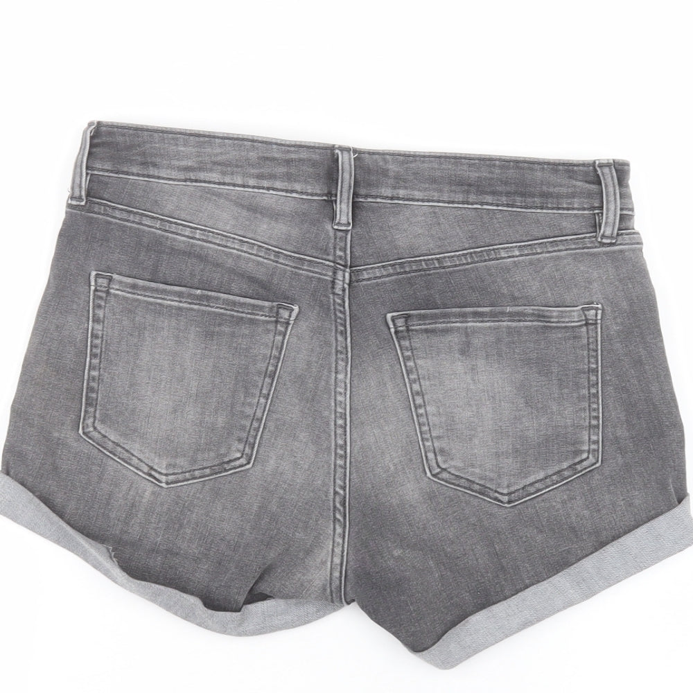 Brand and care label for H&M women’s black bermuda shorts, size UK 8