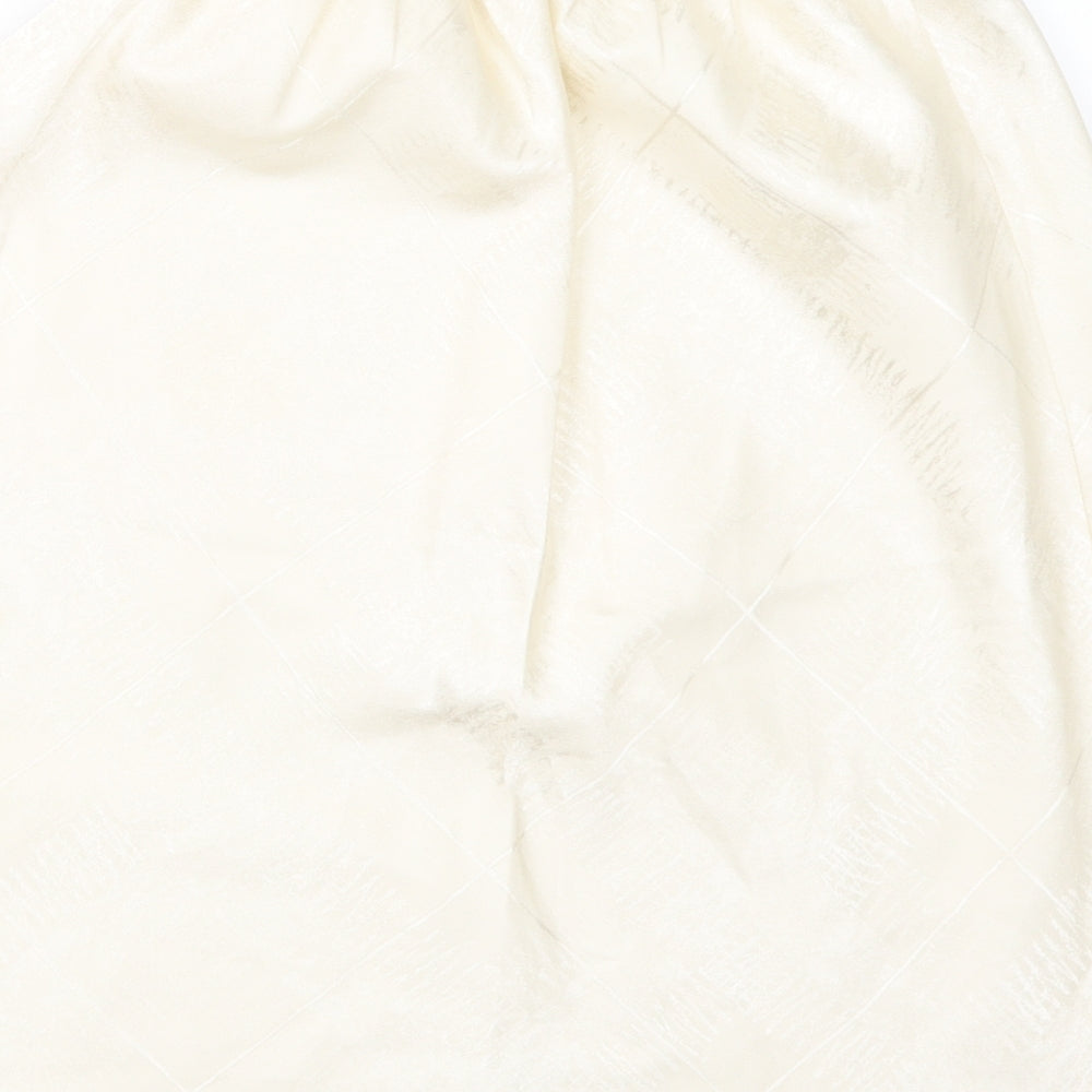 Brand and care label for Marks & Spencer women’s ivory a-line skirt, size UK 16