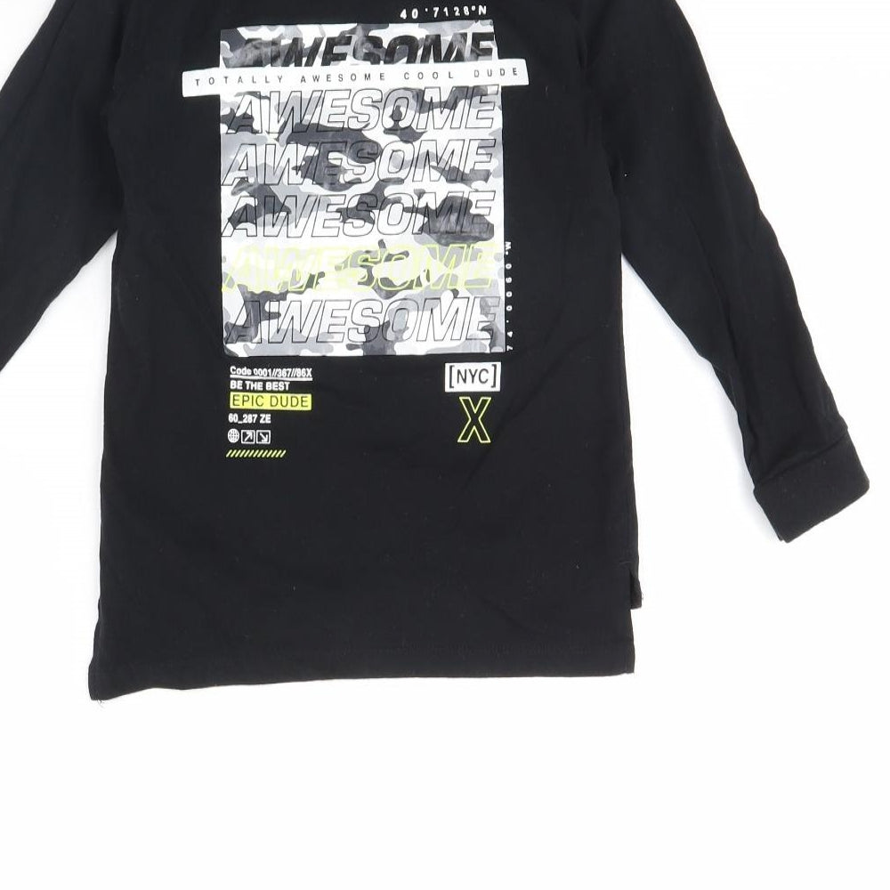 Brand and care label for Primark boys’ black basic t-shirt, size 4, years