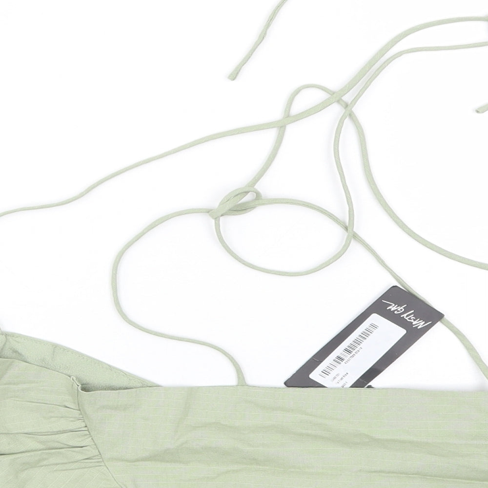Brand and care label for Nasty Gal women’s green cropped tank, size UK 6