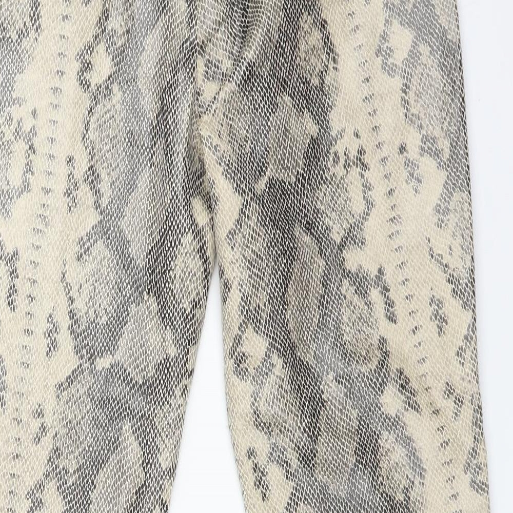 Brand and care label for Primark women’s multicoloured animal print jegging trousers, size UK 14, 27-inch leg