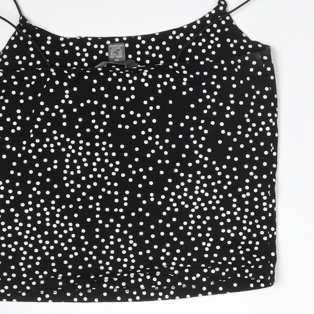 Brand and care label for Primark women’s black polka dot camisole t-shirt, size XS