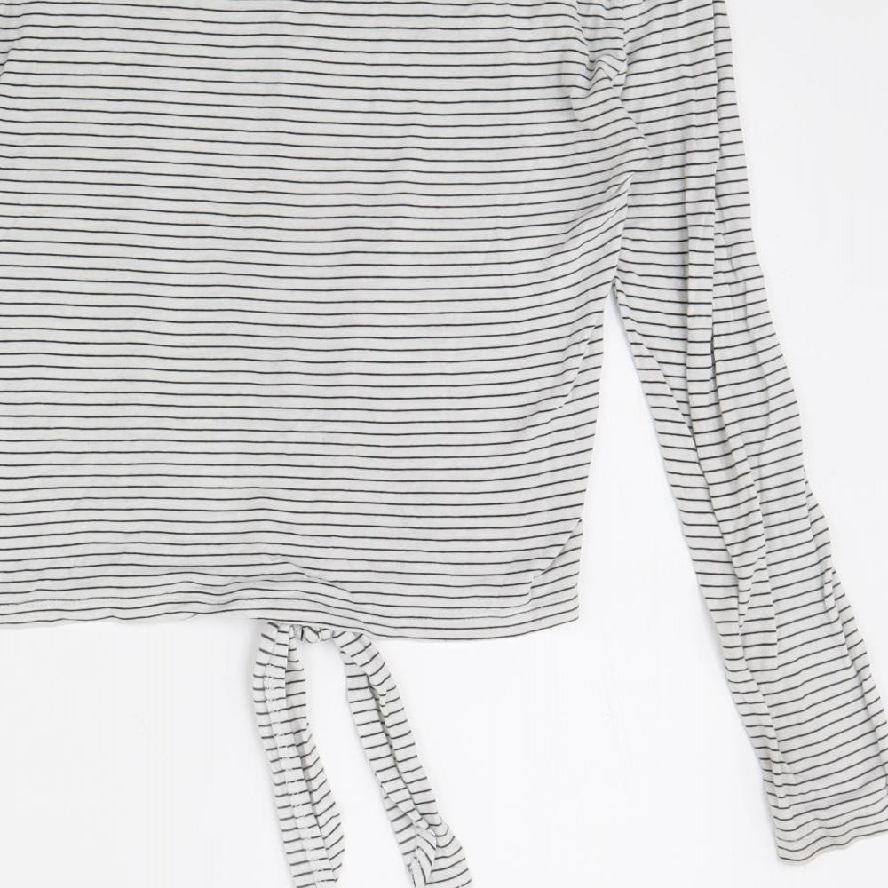 Brand and care label for River Island women’s white striped jumper, size UK 10