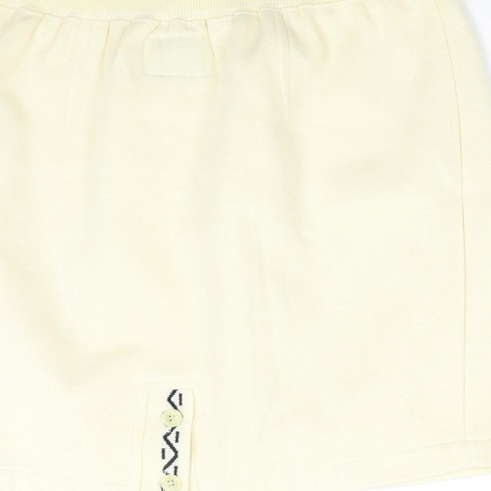 Brand and care label for Dash women’s ivory mini skirt, size S
