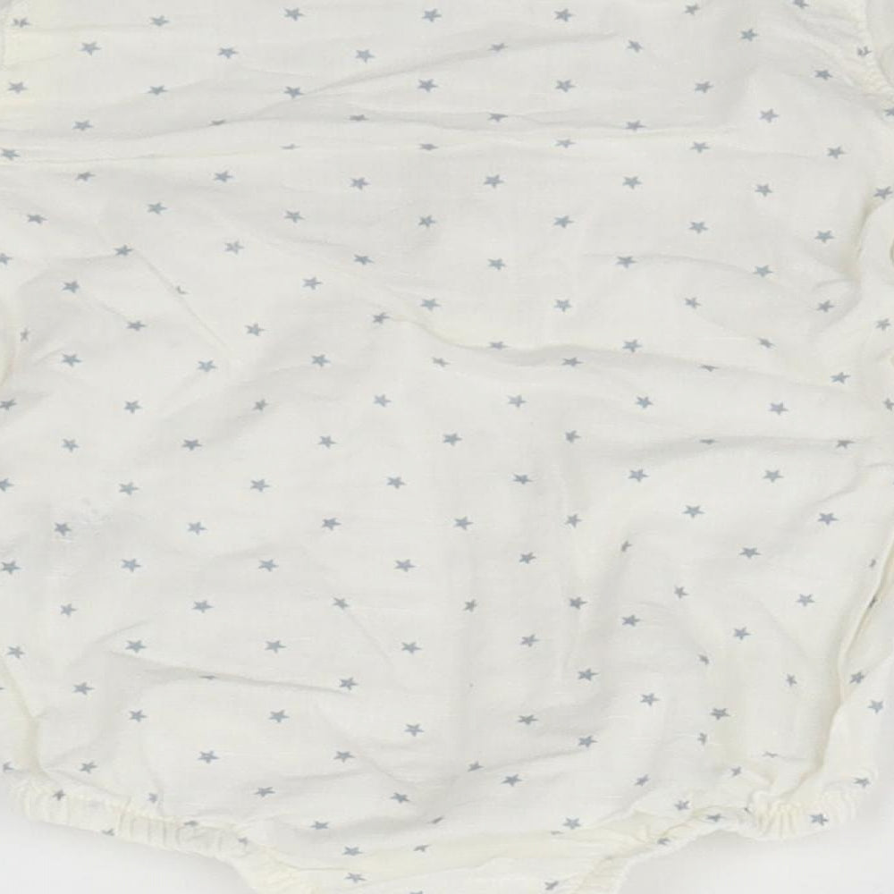 Brand and care label for Tu Baby White Geometric Leotard One-Piece, size 9-12, Months