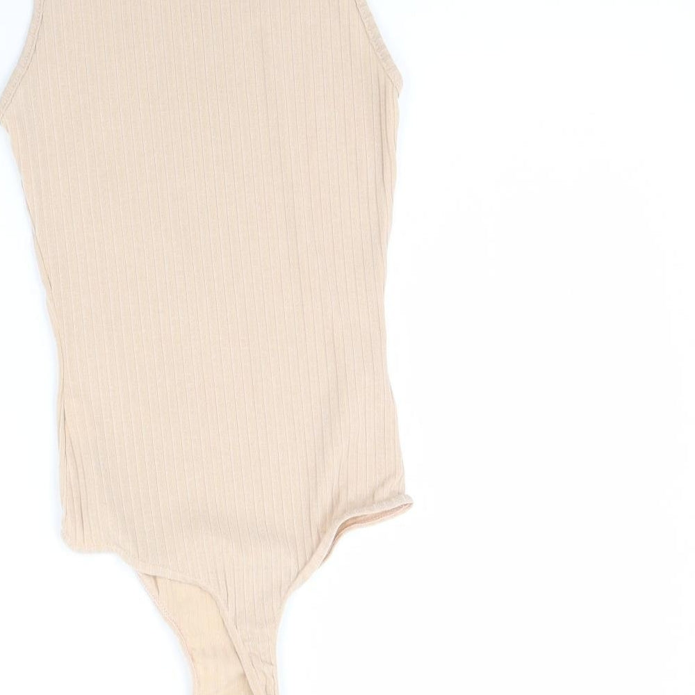 Brand and care label for PRETTYLITTLETHING women’s beige bodysuit one-piece, size UK 4