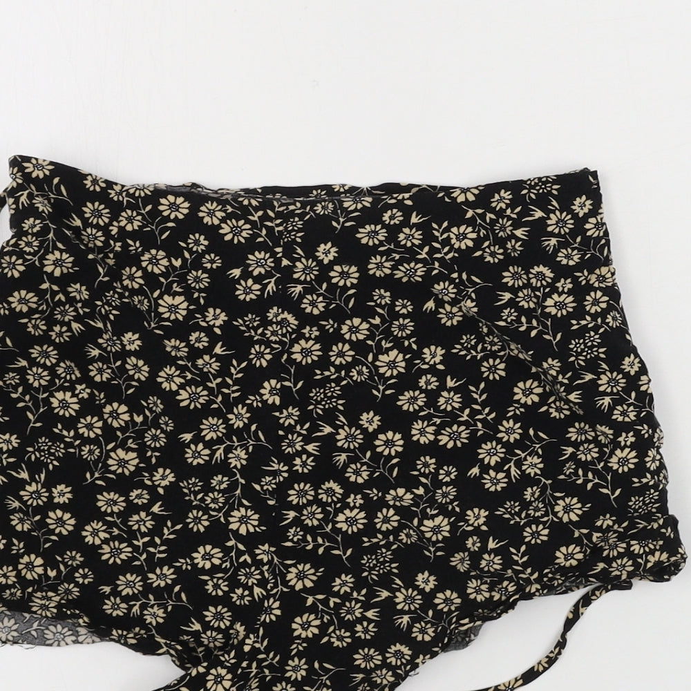 Brand and care label for Forever 21 women’s black floral sweat shorts, size XS