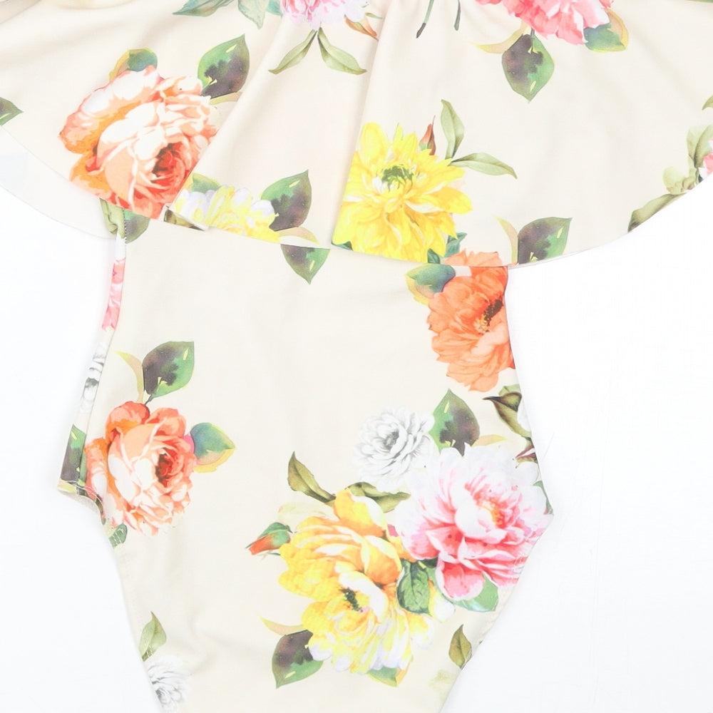 Brand and care label for New Look women’s beige floral catsuit one-piece, size UK 8