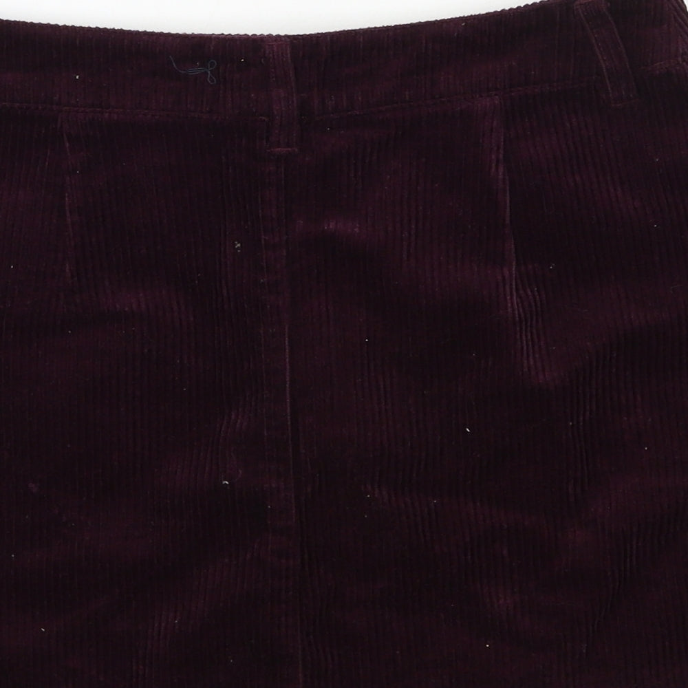 Brand and care label for Forever 21 women’s purple corduroy a-line skirt, size S