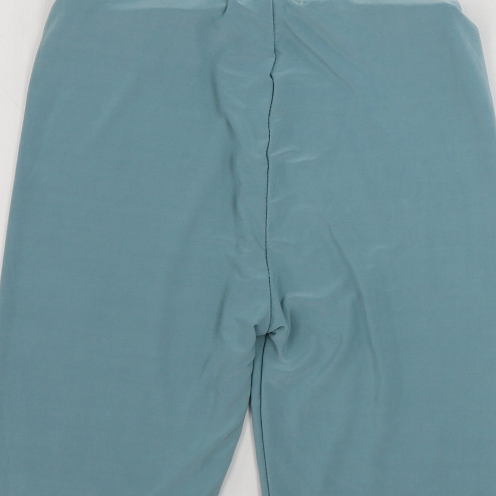 Brand and care label for PRETTYLITTLETHING women’s blue sweat shorts, size UK 6