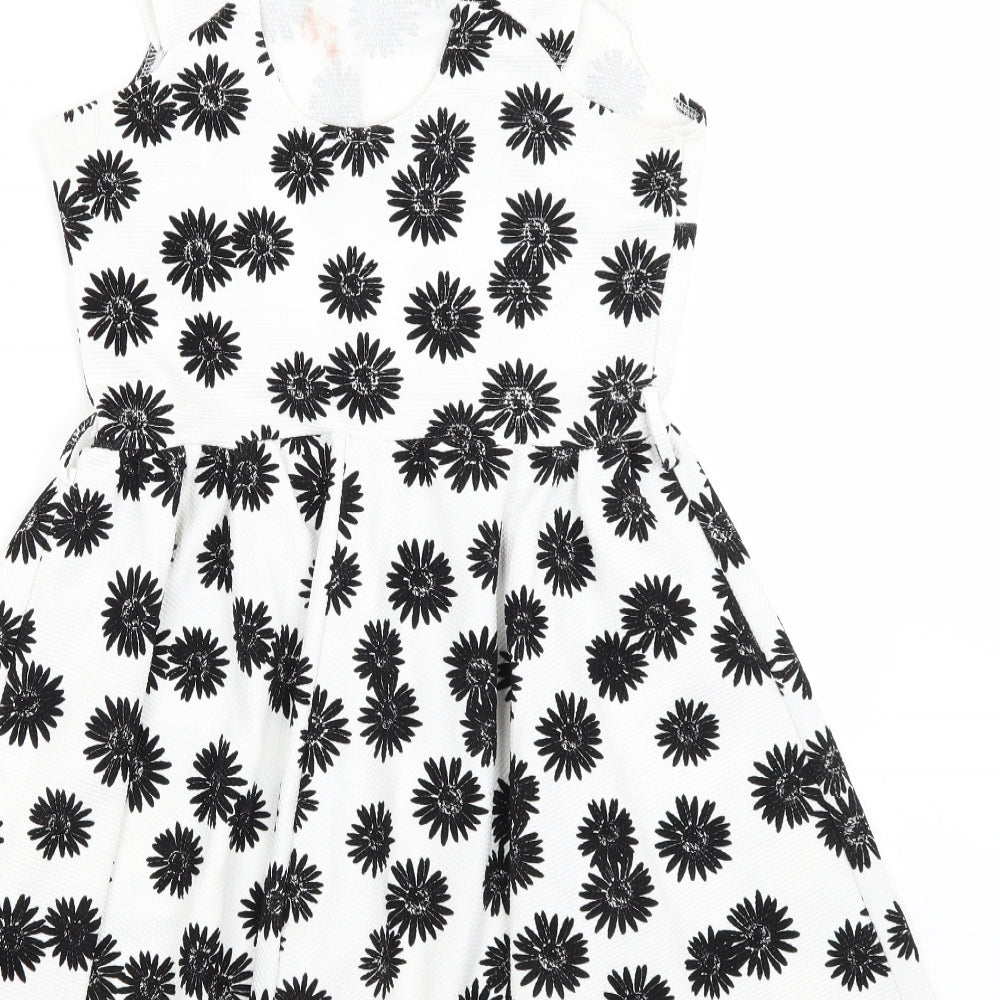 Brand and care label for Club L women’s white floral fit & flare, size UK 12