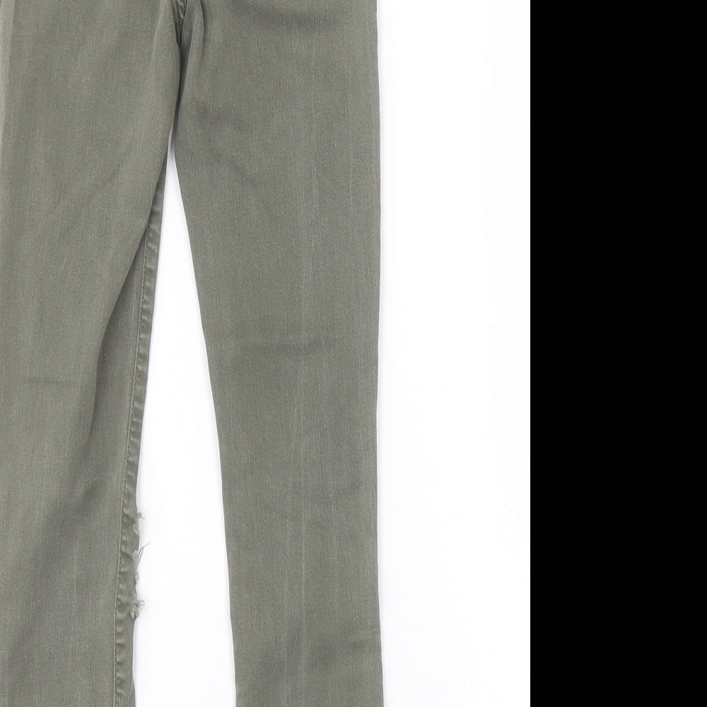 Brand and care label for New Look women’s green skinny jeans, size UK 10, 25-inch leg