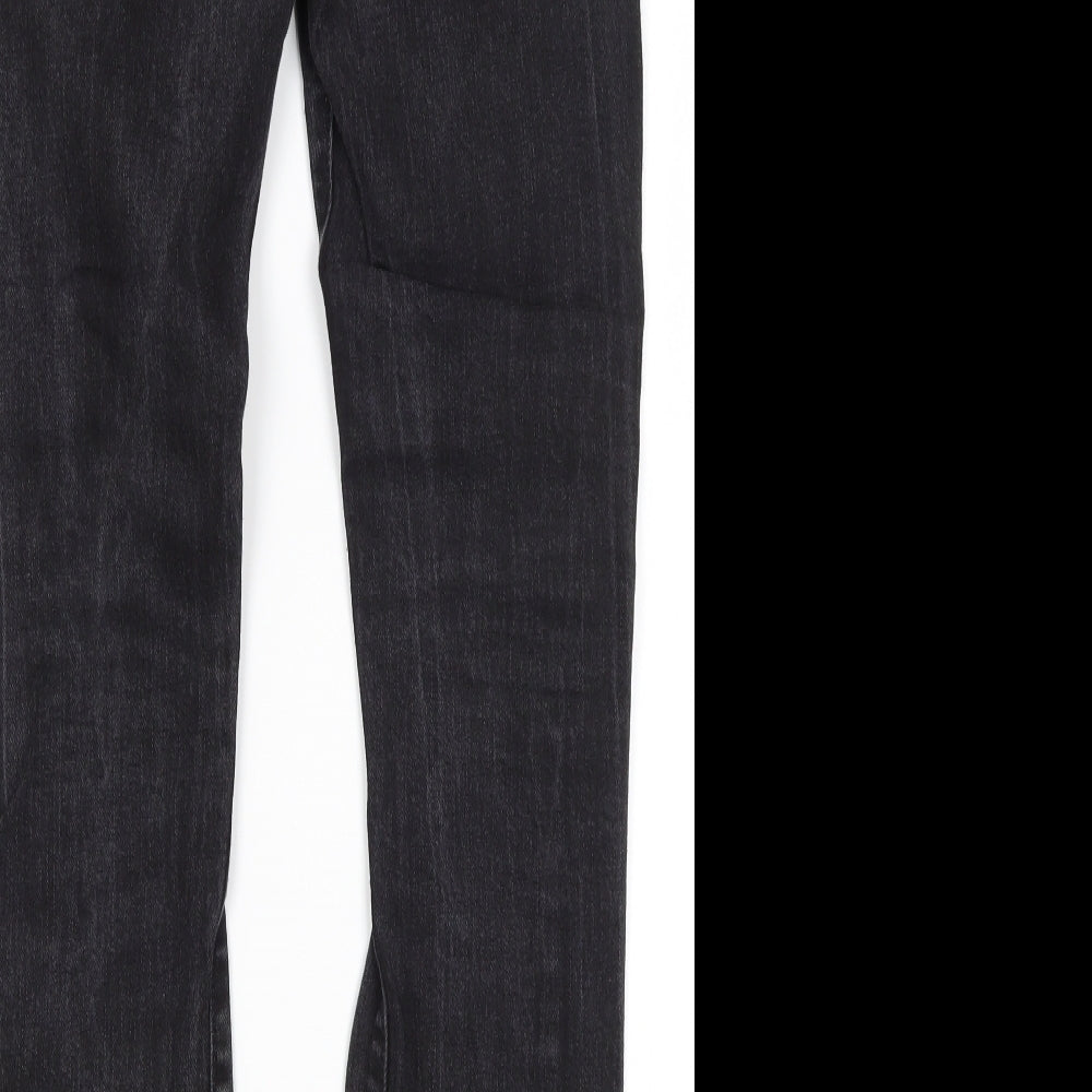 Brand and care label for H&M men’s black cotton skinny jeans, size 30, in, 27-inch leg regular