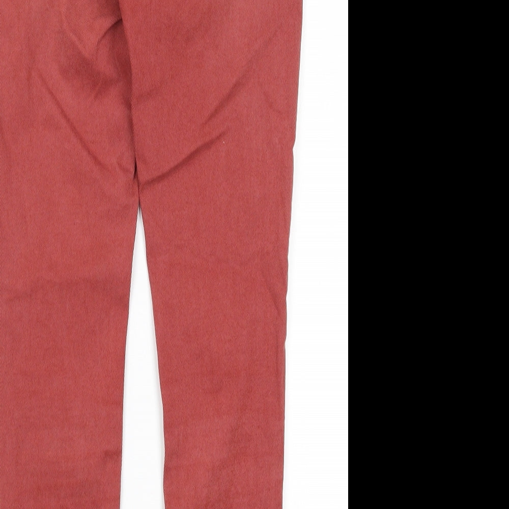 Brand and care label for EDC women’s red cotton skinny jeans, size UK 34, in, 26-inch leg regular