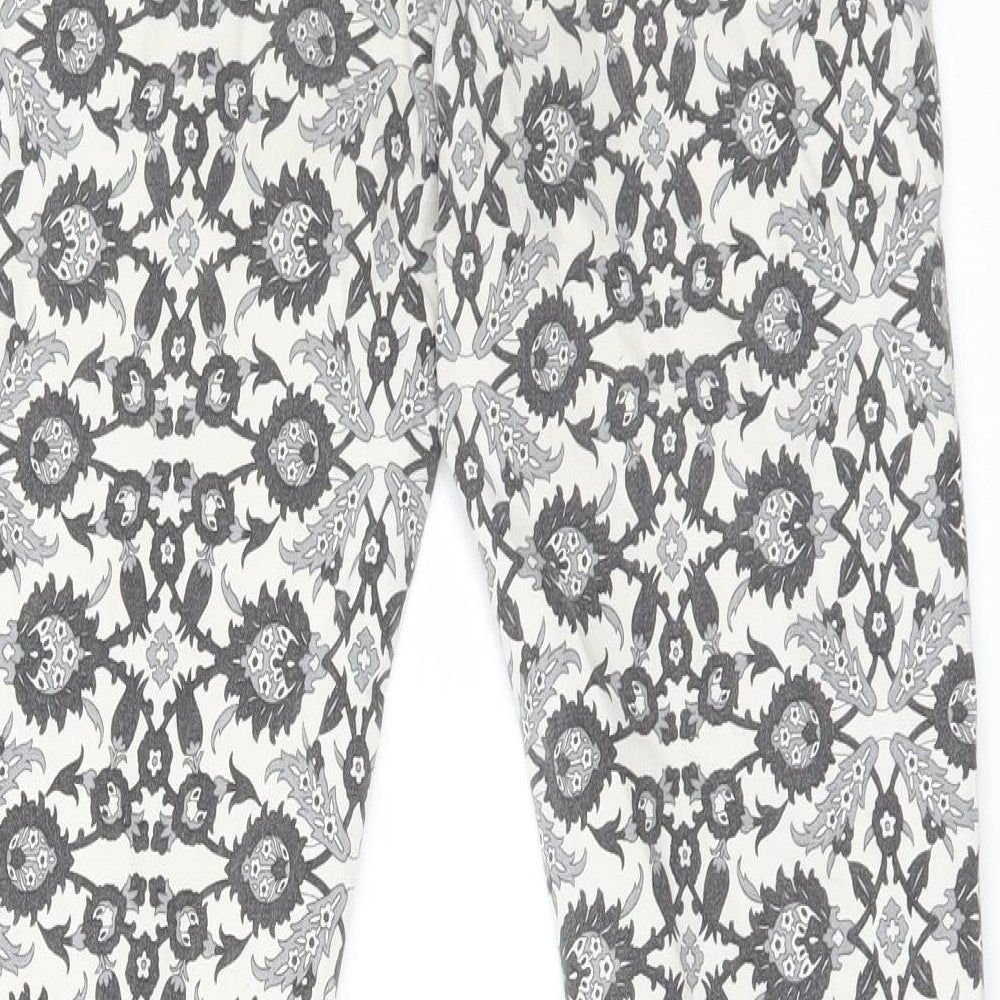 Brand and care label for Zara women’s multicoloured floral skinny jeans, size UK 30, 26-inch leg regular