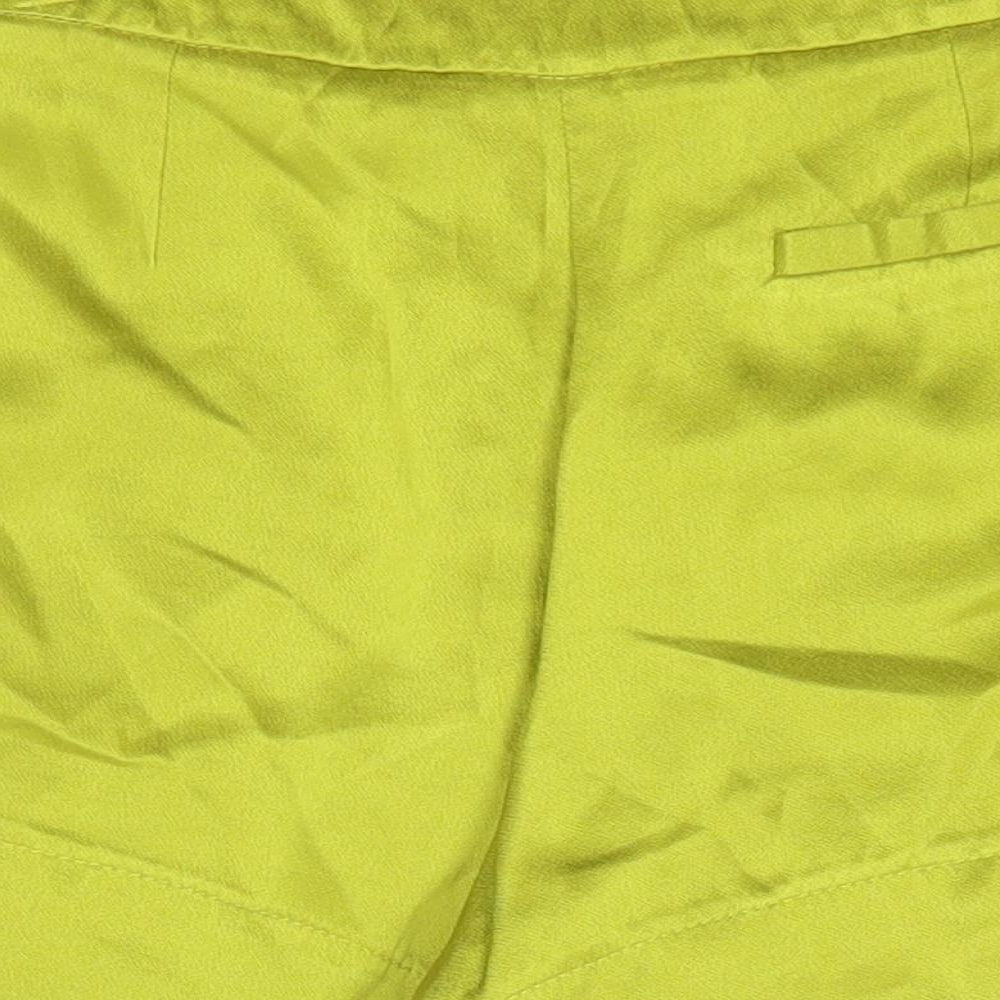 Brand and care label for Topshop women’s green viscose boyfriend shorts, size UK 10, regular