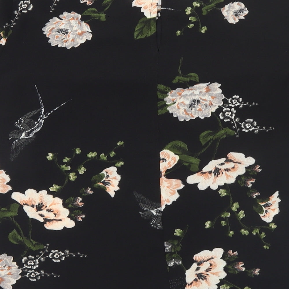 Brand and care label for AX Paris women’s black floral polyester basic t-shirt, size UK 8, round neck
