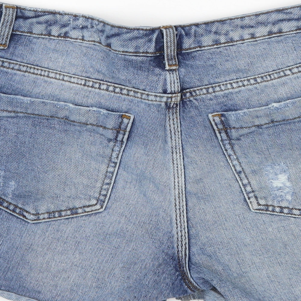 Brand and care label for Topshop women’s blue cotton cut-off shorts, size UK 28, in, 3-inch leg regular