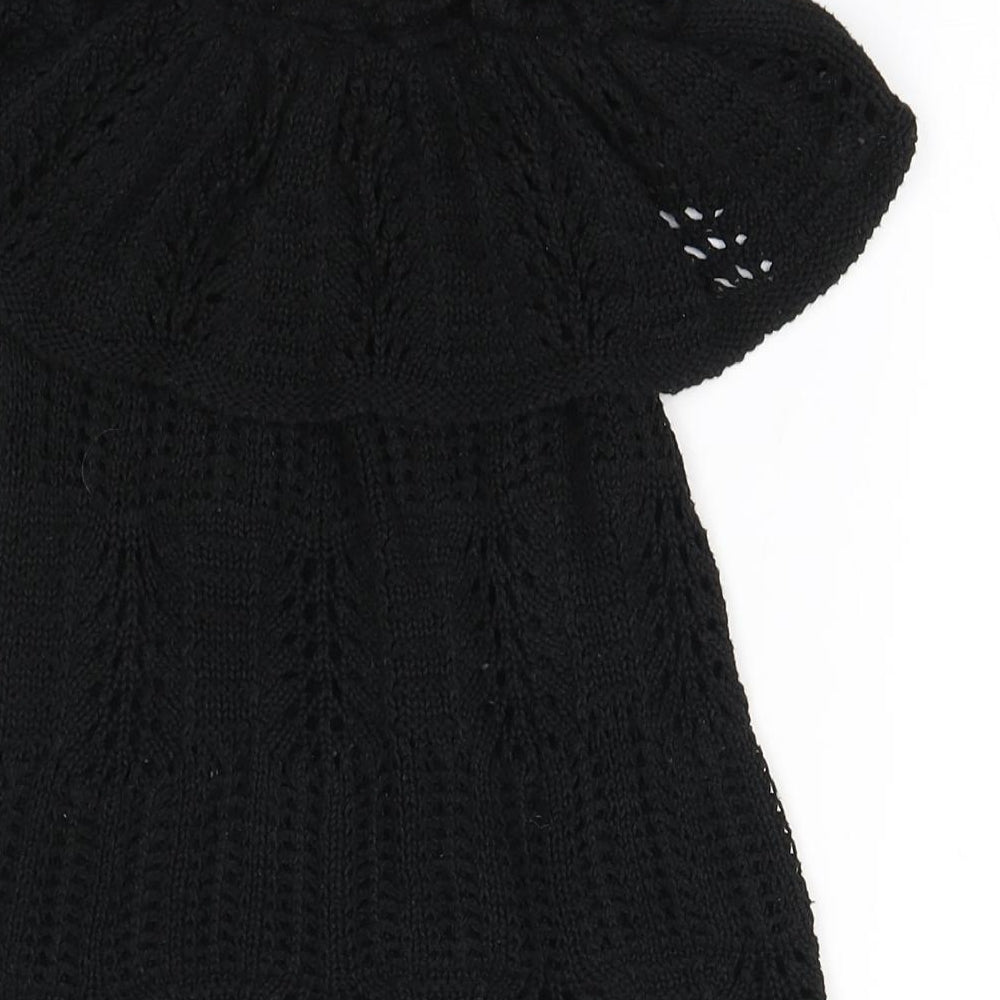 Brand and care label for Topshop women’s black acrylic a-line, size UK 8, off the shoulder