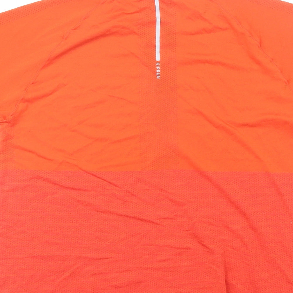 Brand and care label for Decathlon women’s orange polyester basic t-shirt, size M, round neck