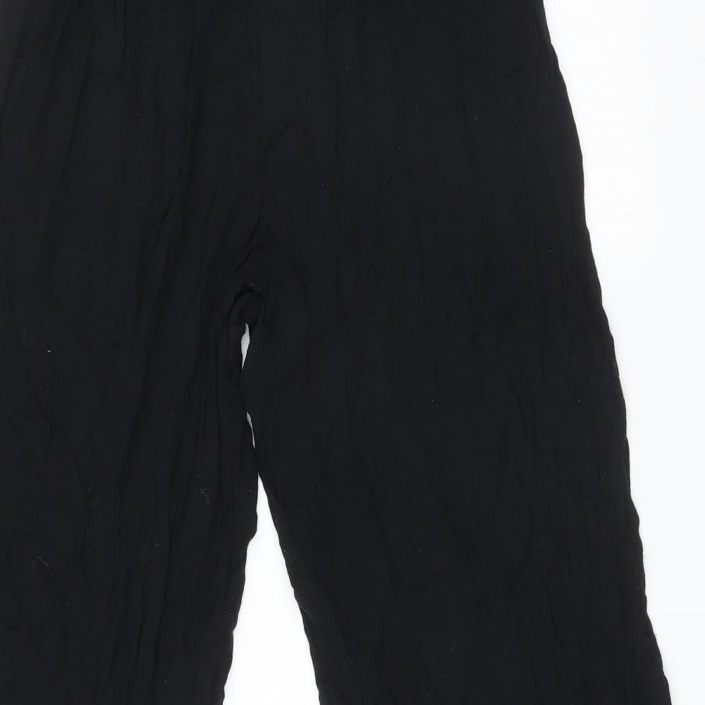 Brand and care label for Topshop women’s black viscose trousers, size UK 10, 22-inch leg regular