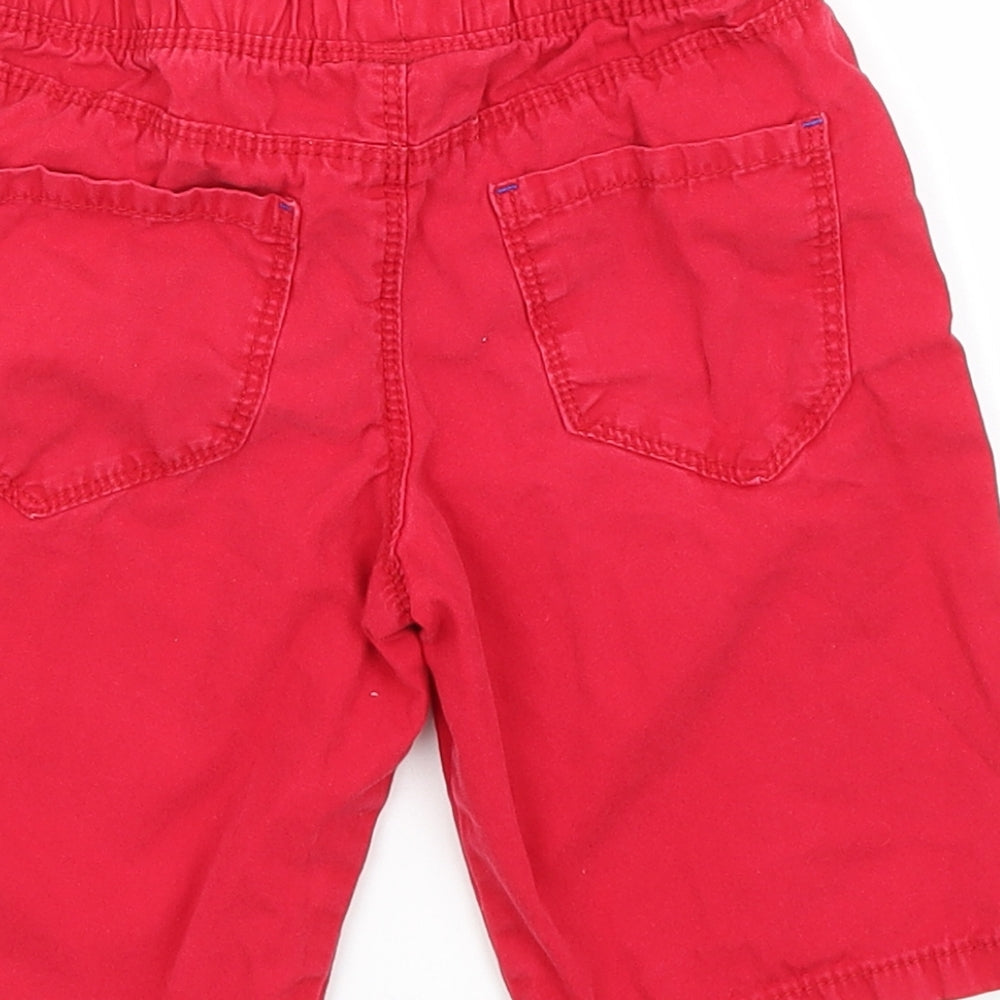 Brand and care label for Rebel girls’ red cargo shorts, size 4-5, years regular