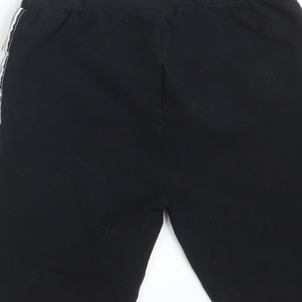 Brand and care label for Ellesse women’s black cotton compression shorts, size UK 6, 10-inch leg athletic - waist 20in