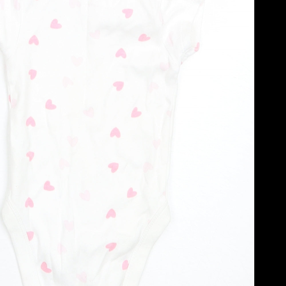Brand and care label for Pure Baby Baby White Cotton Romper One-Piece, size 3-6, Months