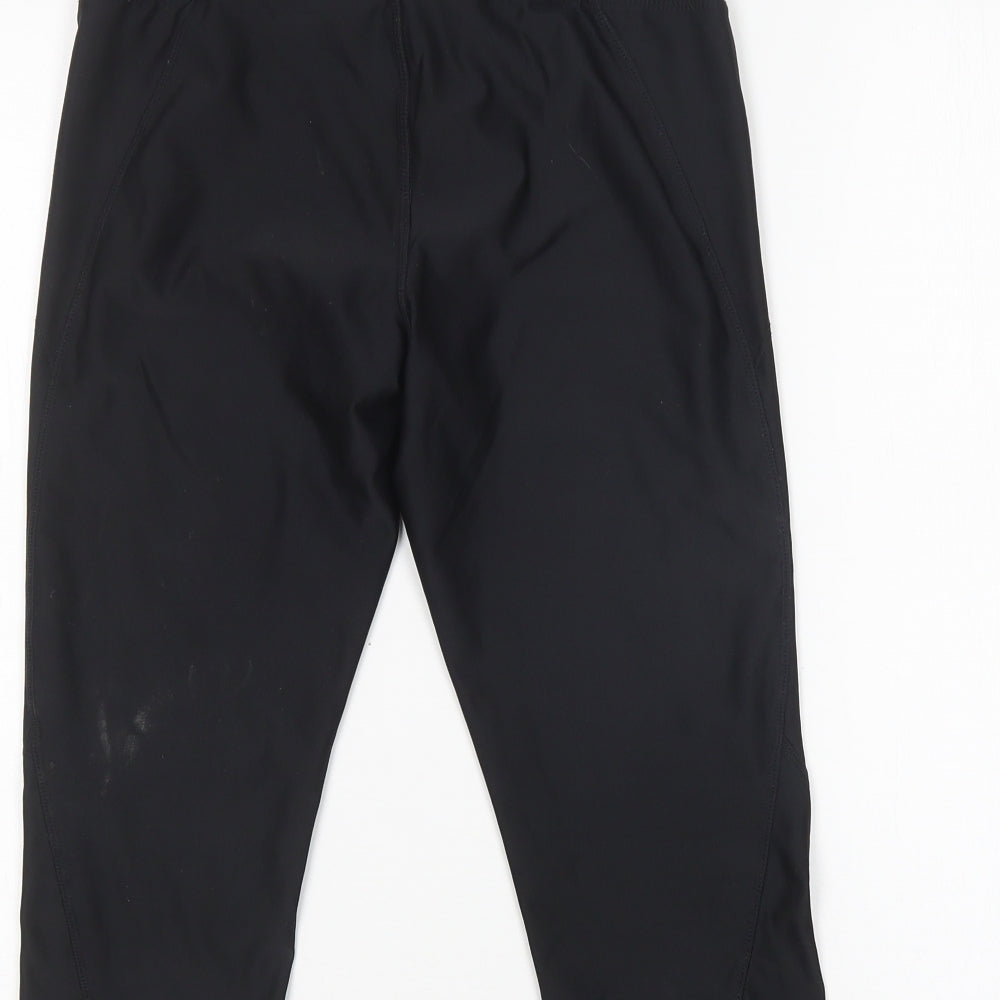 Brand and care label for Athletic Works women’s black compression shorts, size S, 17-inch leg regular
