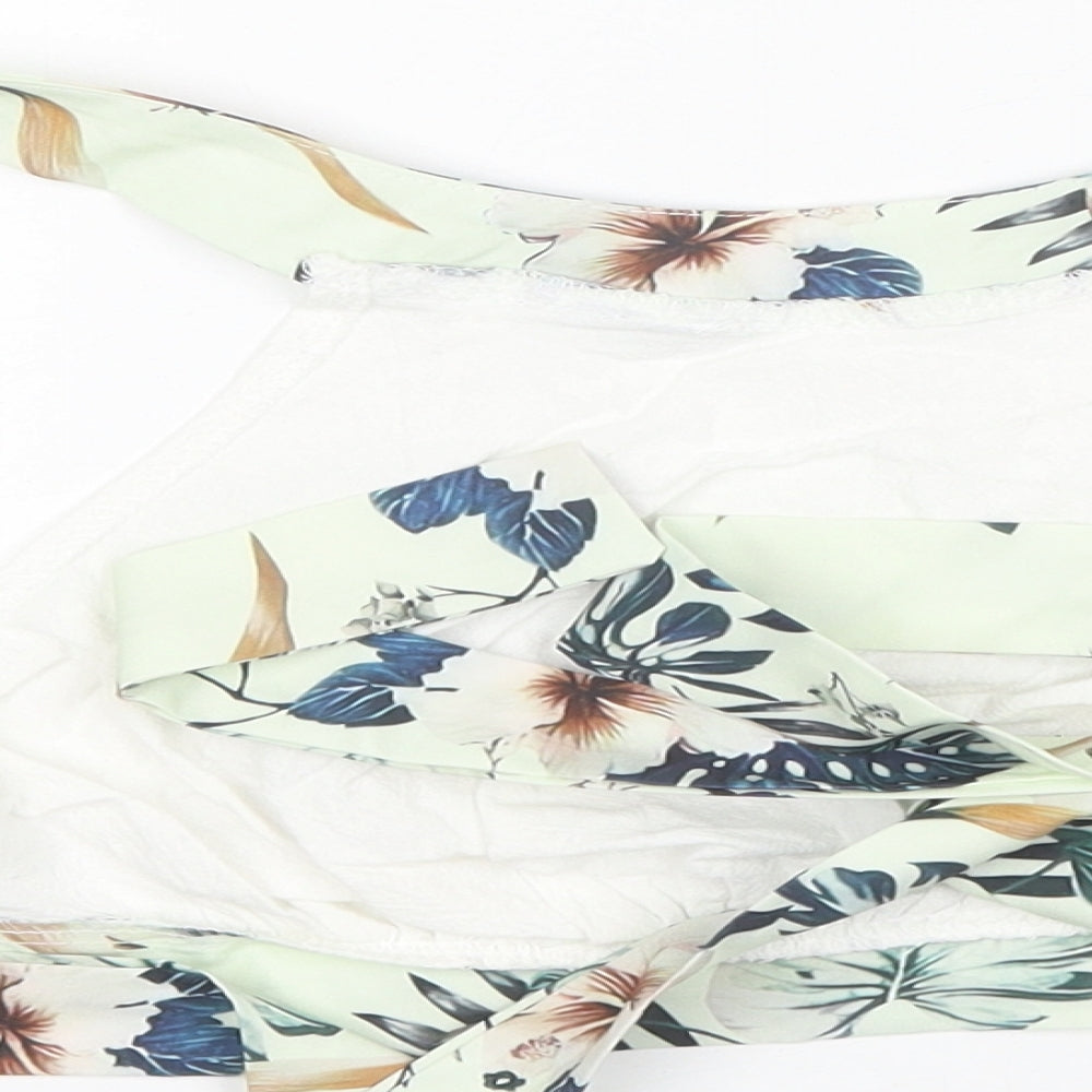 Brand and care label for SHEIN women’s white floral polyester cropped tank, size M, round neck