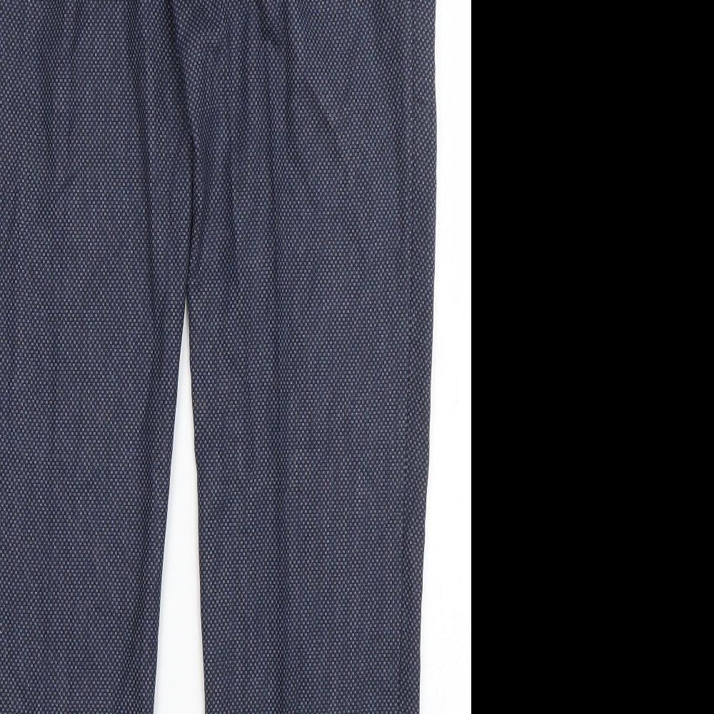 Brand and care label for Preworn men’s blue polyester dress pants trousers, size 32, in, 28-inch leg regular