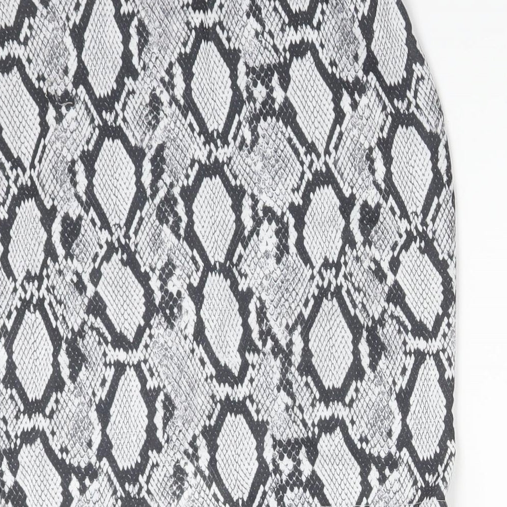 Brand and care label for Missguided women’s multicoloured animal print polyester straight & pencil skirt, size UK 6