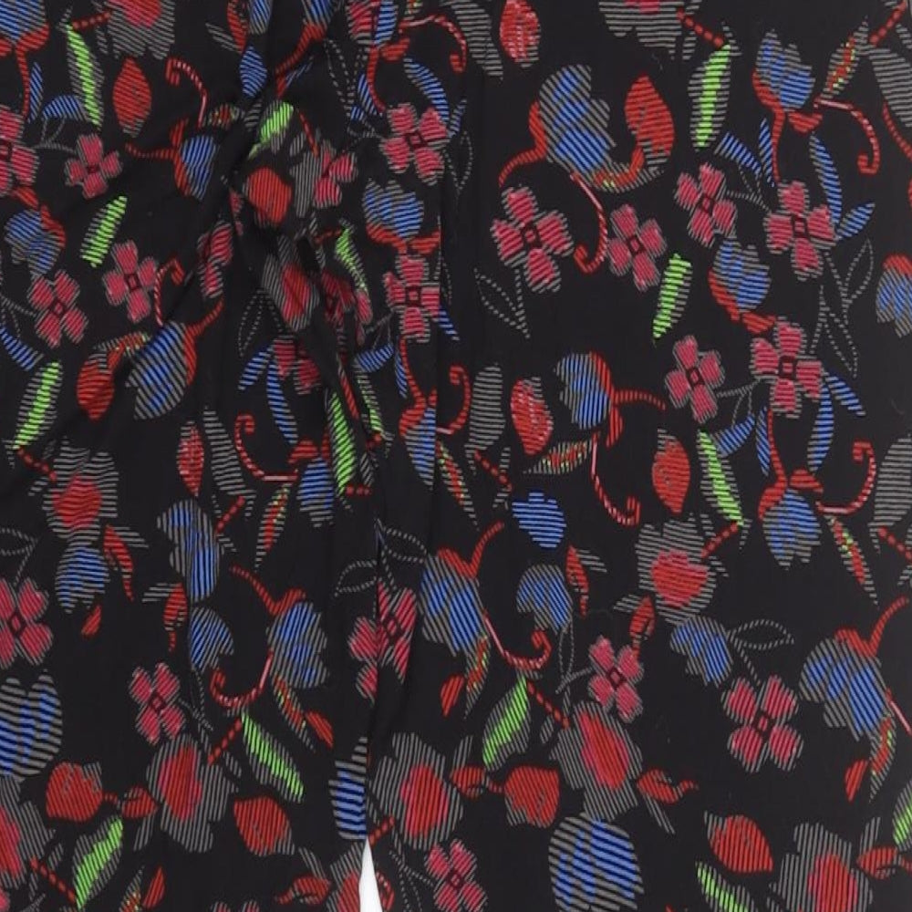 Brand and care label for F&F women’s black floral viscose sweatpants, size UK 14, 26-inch leg regular