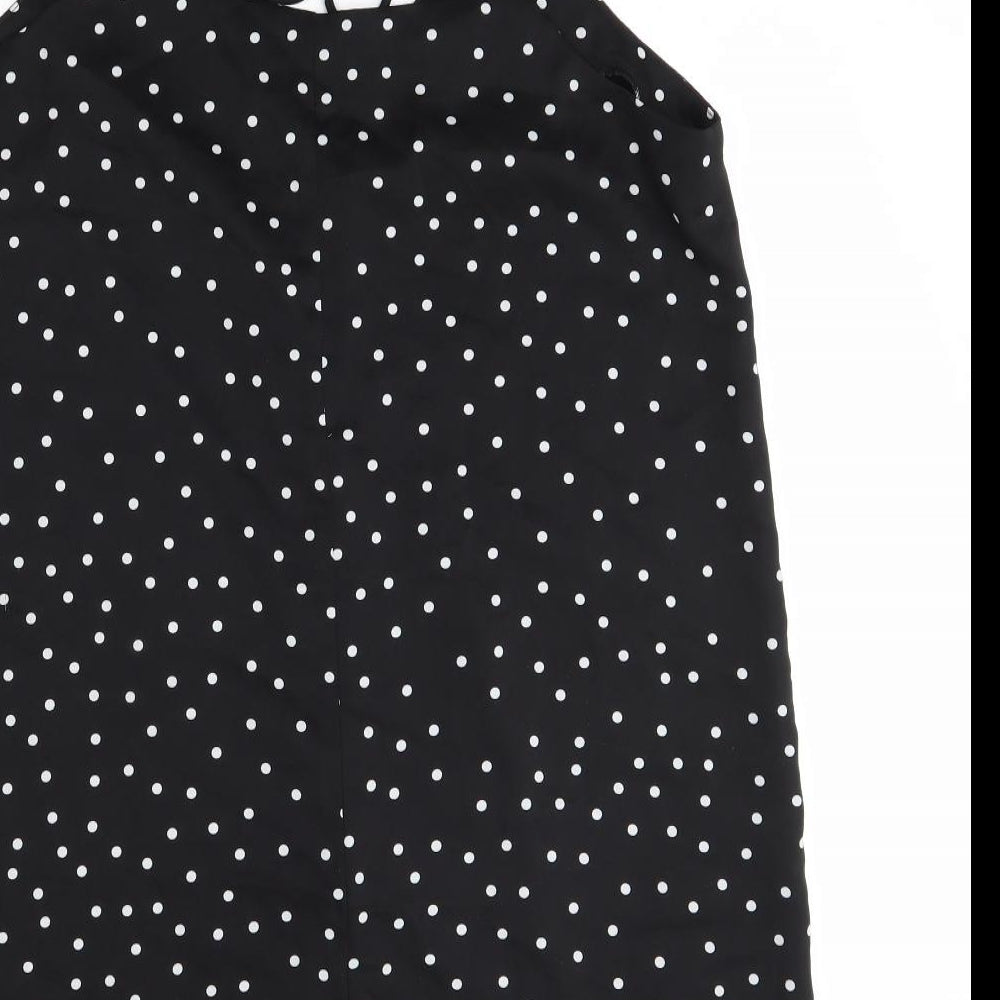 Brand and care label for Nasty Gal women’s black polka dot polyester tank dress, size UK 12, v-neck