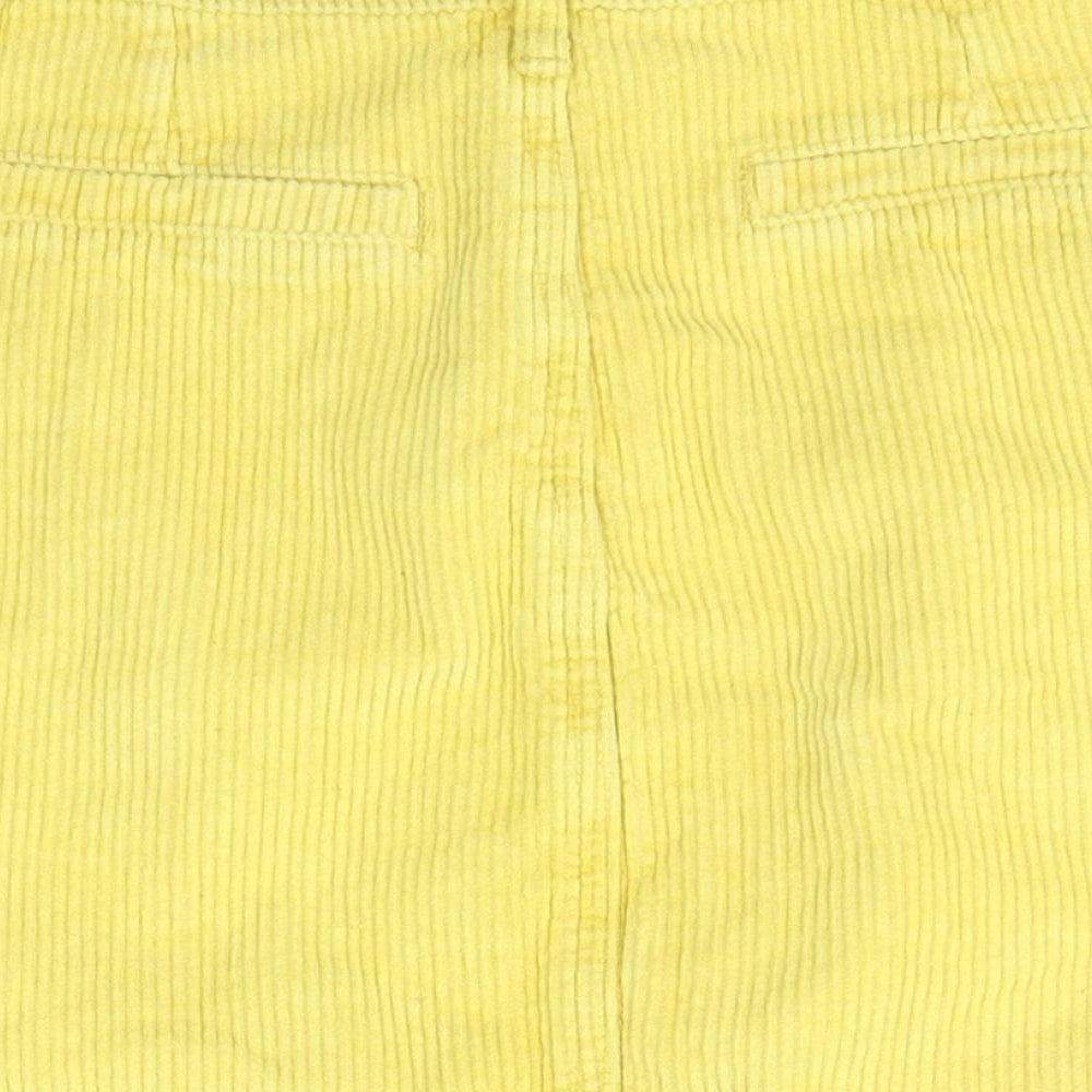 Brand and care label for Missguided women’s yellow cotton a-line skirt, size UK 6
