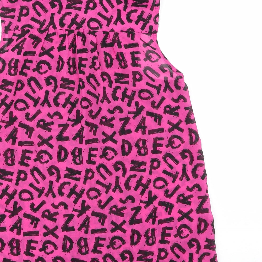 Brand and care label for F&F girls’ multicoloured animal print 100% polyester basic button-up, size 12-13, years collared
