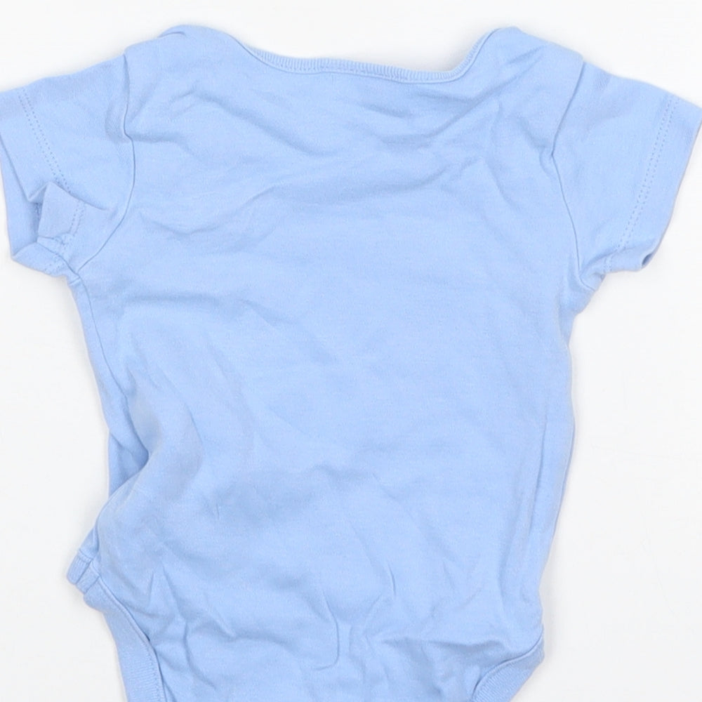 Brand and care label for Next boys’ blue cotton leotard one-piece, size 3-6, months