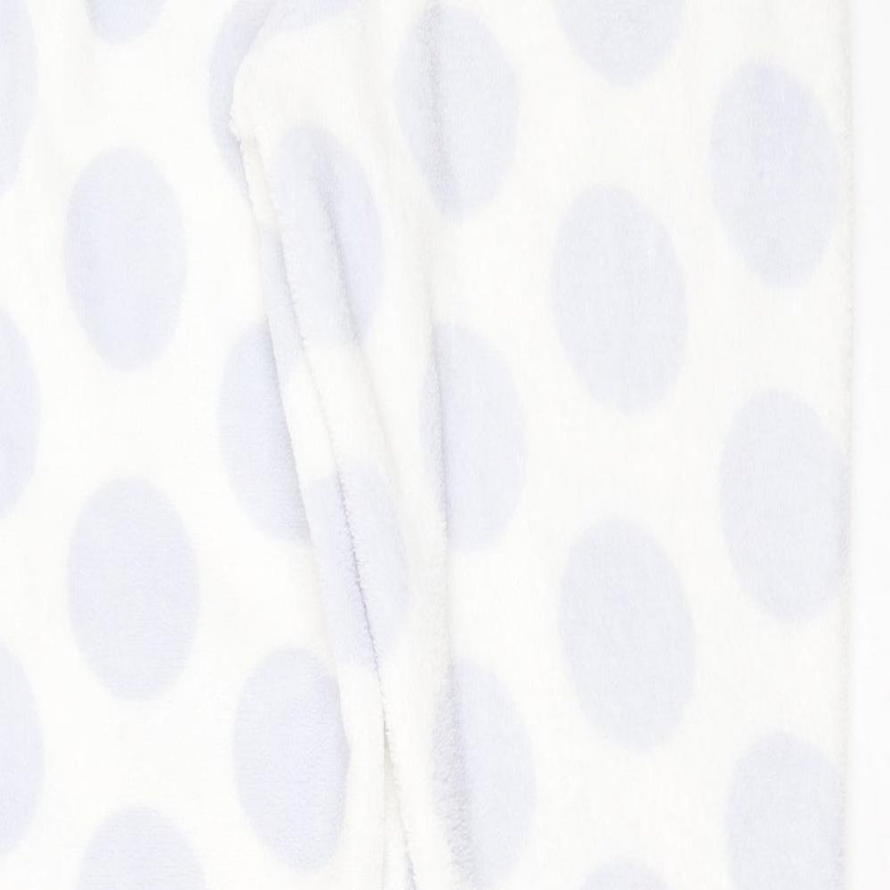 Brand and care label for Primark women’s white polka dot polyester pyjama pants, size M